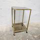Vintage rolling table in brass and smoked glass