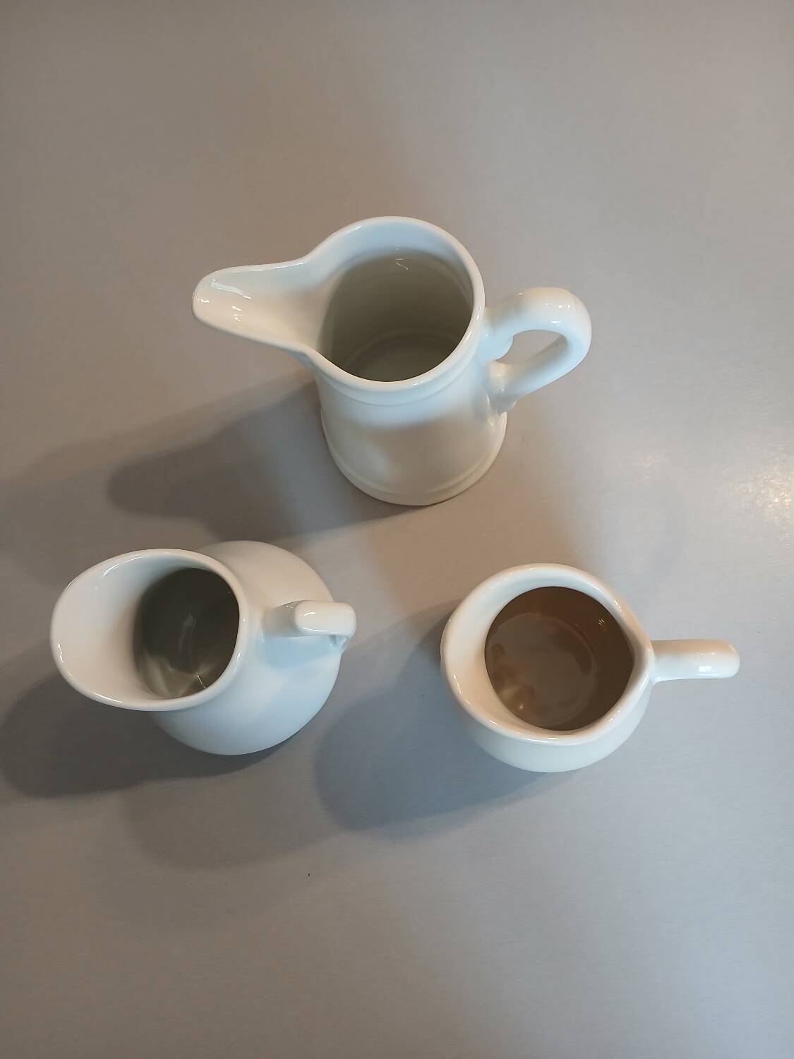 3 small antique porcelain pitchers/milk pots