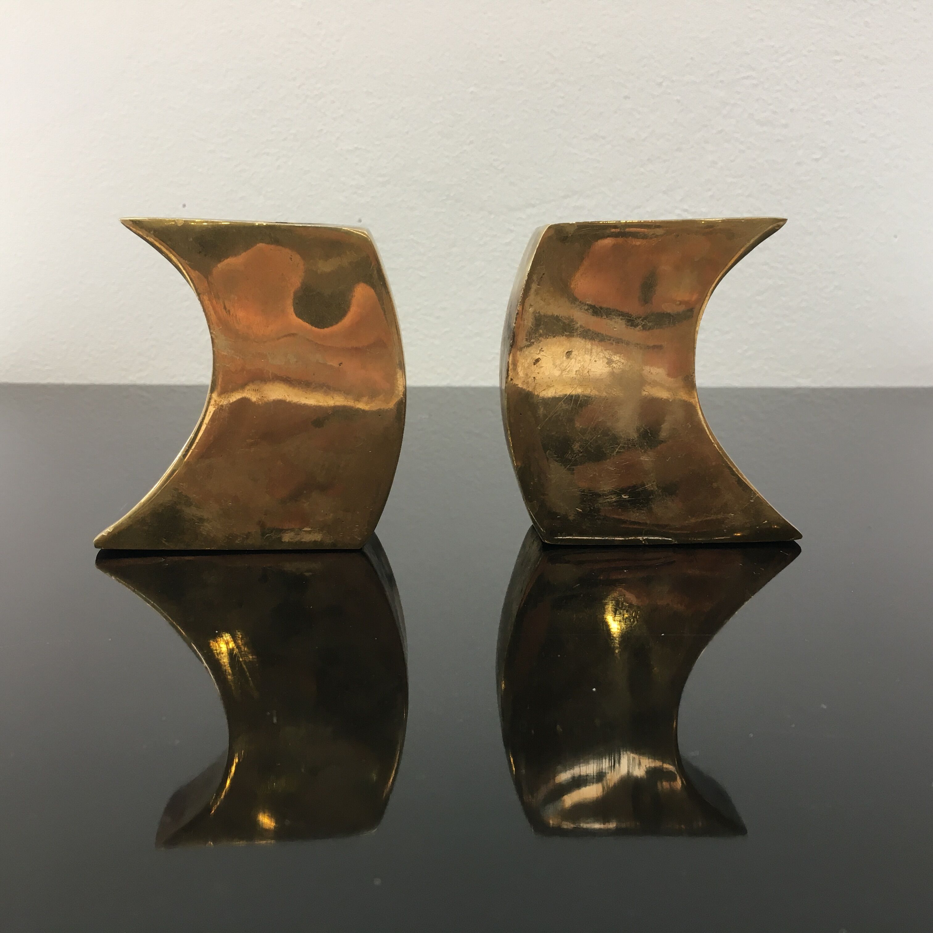 Pair of bronze candle holders by Monique Gerber