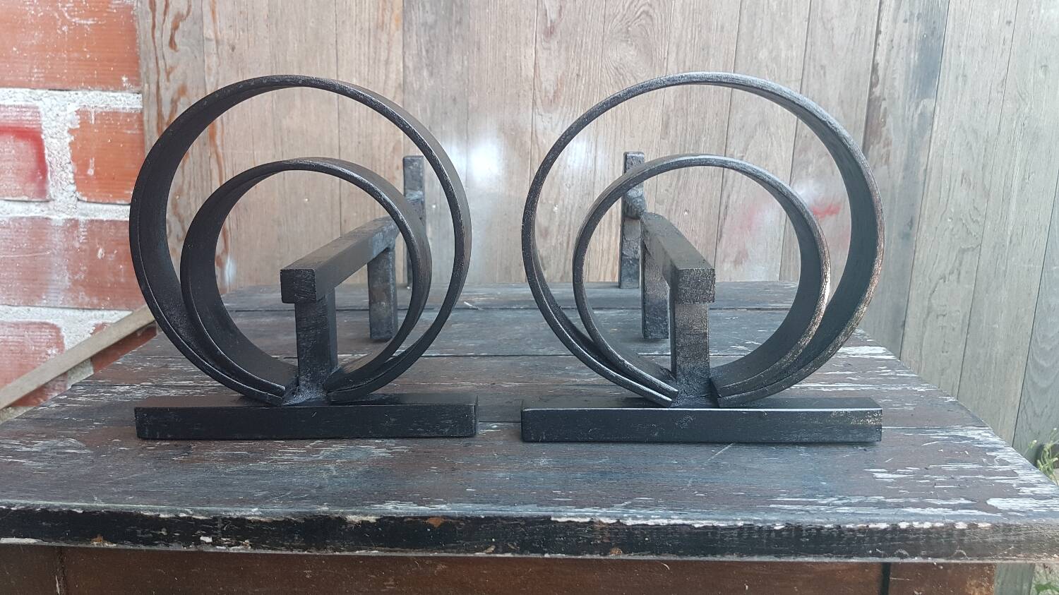 Pair of wrought iron fireplace andirons circular shape vintage