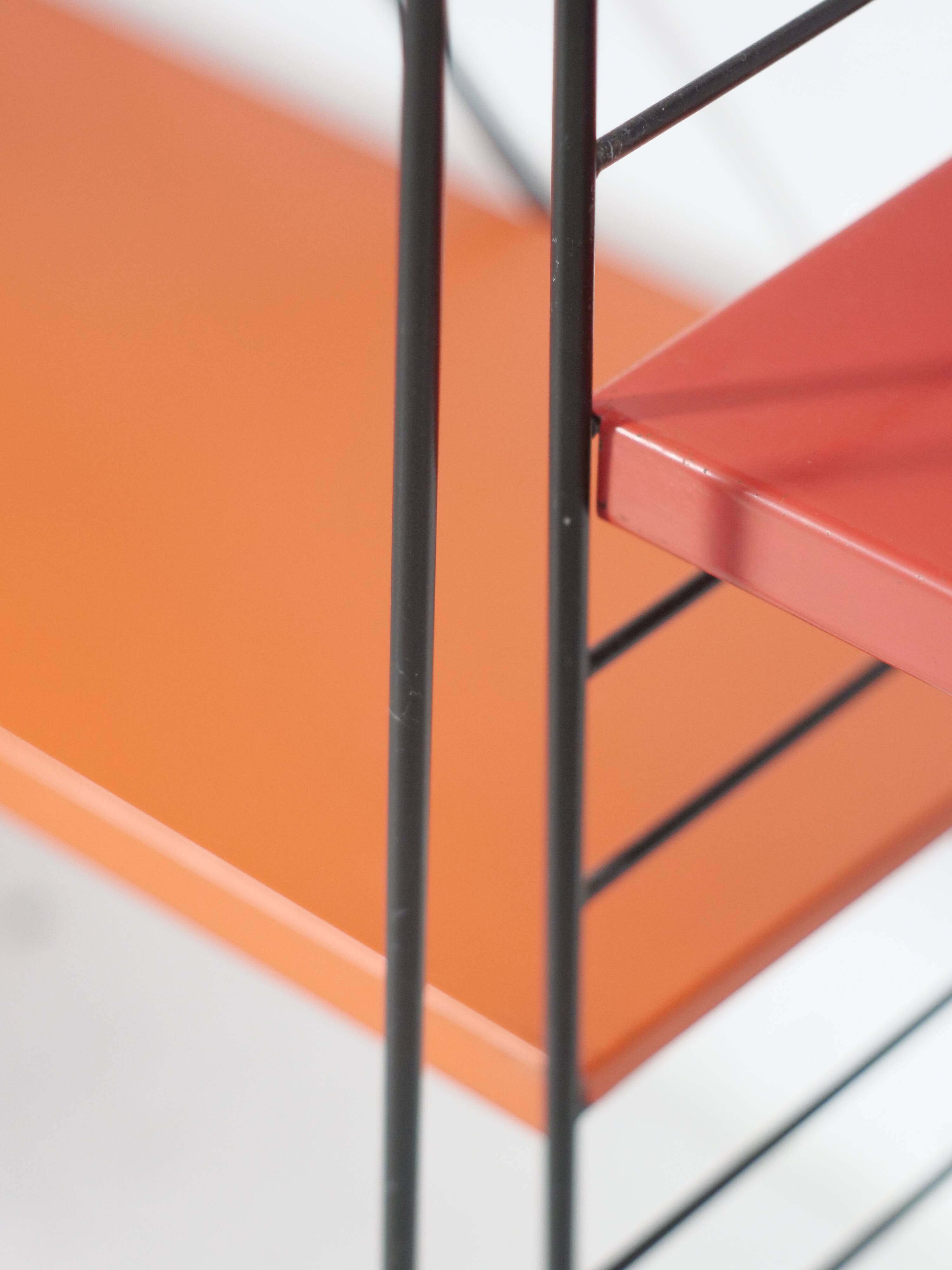 Tomado shelf in coloured metal floor shelves from 1958.