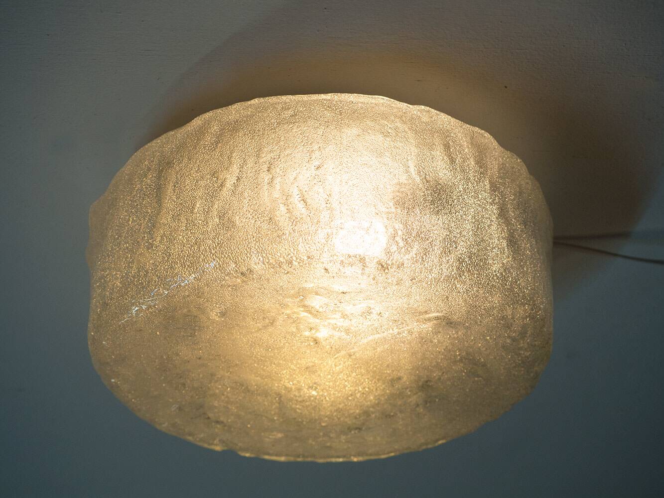 Wall or ceiling lamp made of ice glass