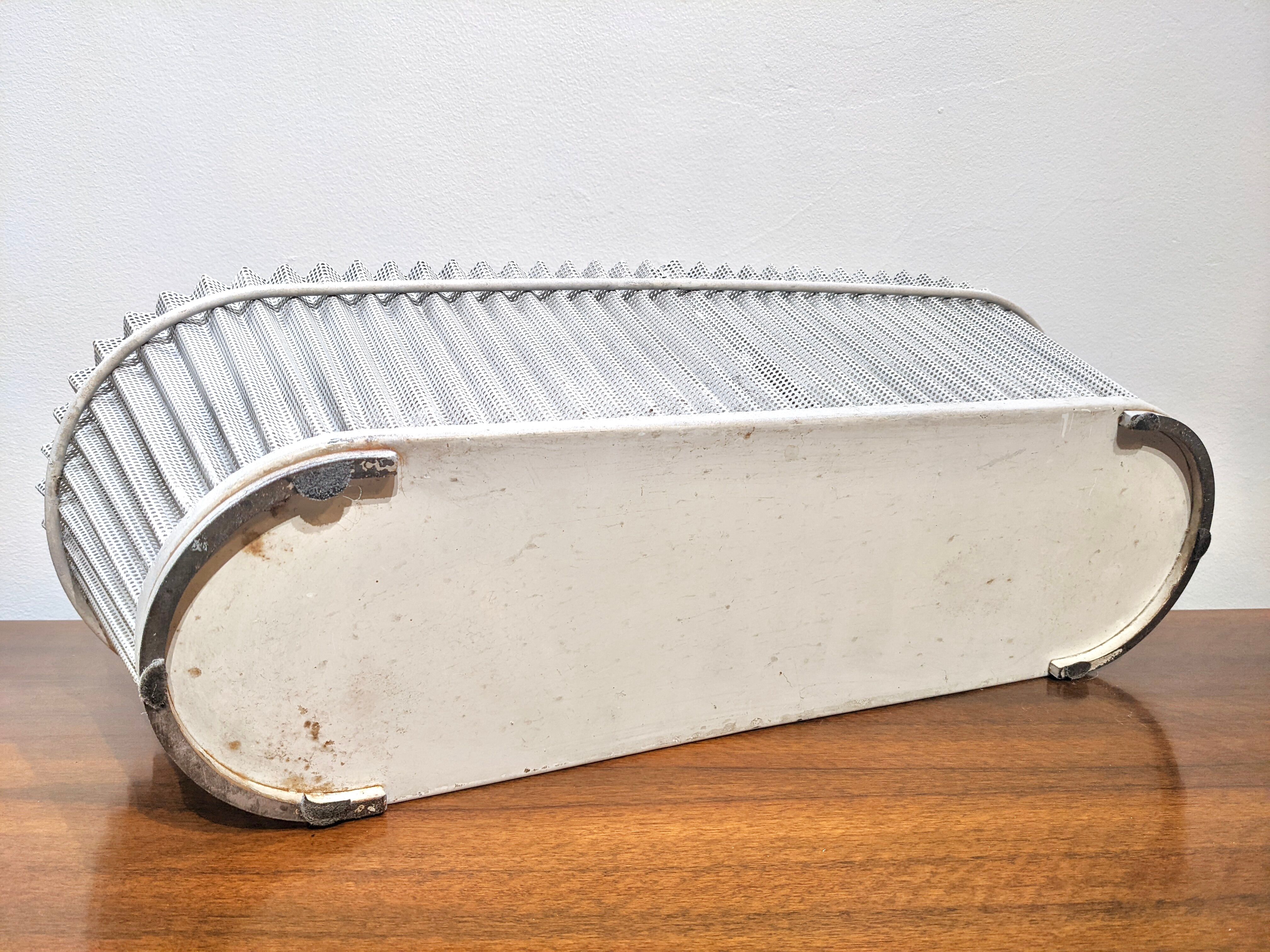 White perforated sheet metal planter by Mathieu Mategot