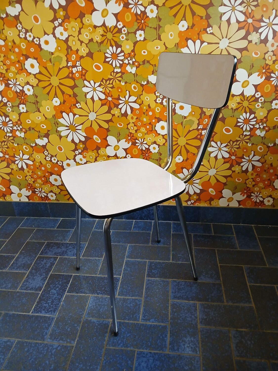 Extendable formica table and vintage 1960s chairs.
