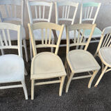 Set of 8 mismatched white bistro chairs
