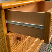 Dresser and its bedside table in rattan caning and vintage oak from the 1970s.