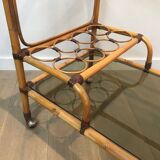 Rolling table made of rattan and leather straps