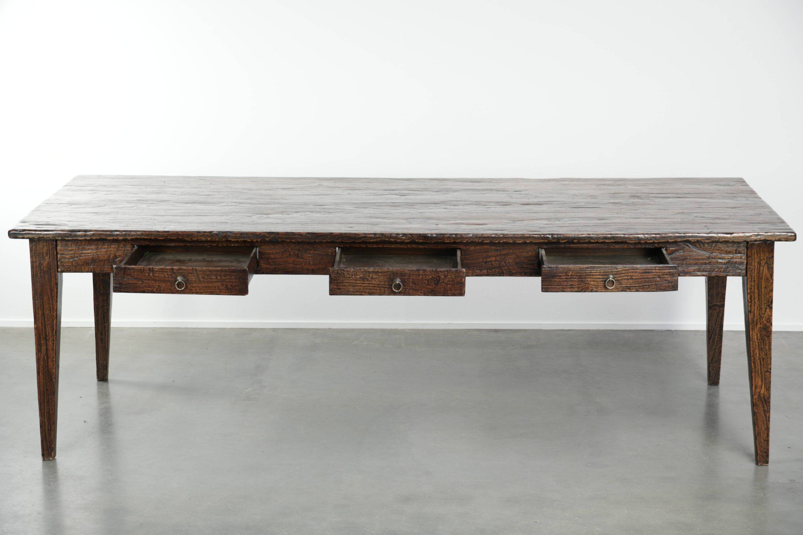 Large rustic dining table made of atmospheric elm wood with fine details
