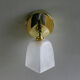 Translucent antique glass wall lamp mounted on a brass metal stand