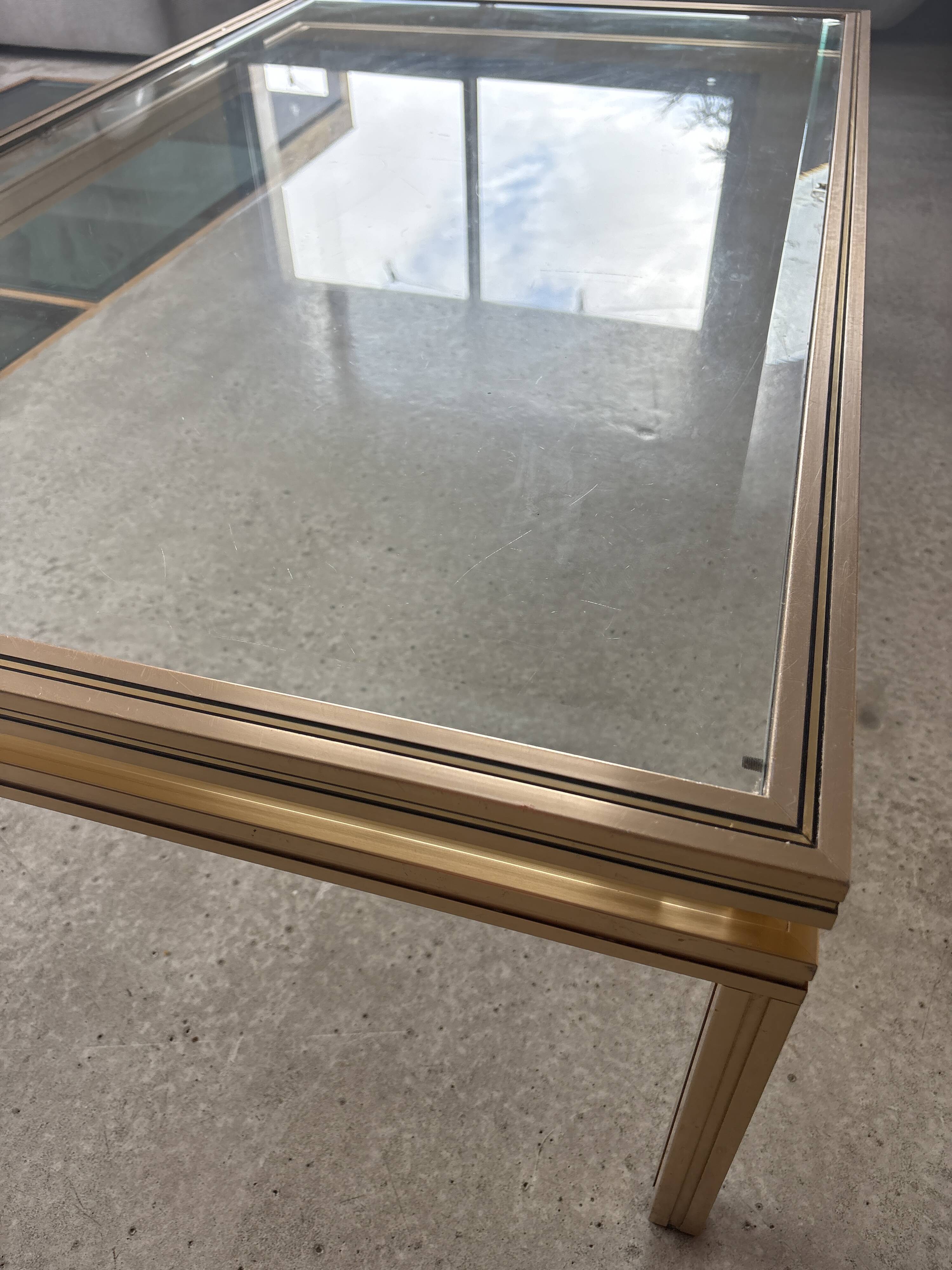 Brass/glass table designed by Pierre Vandel Paris