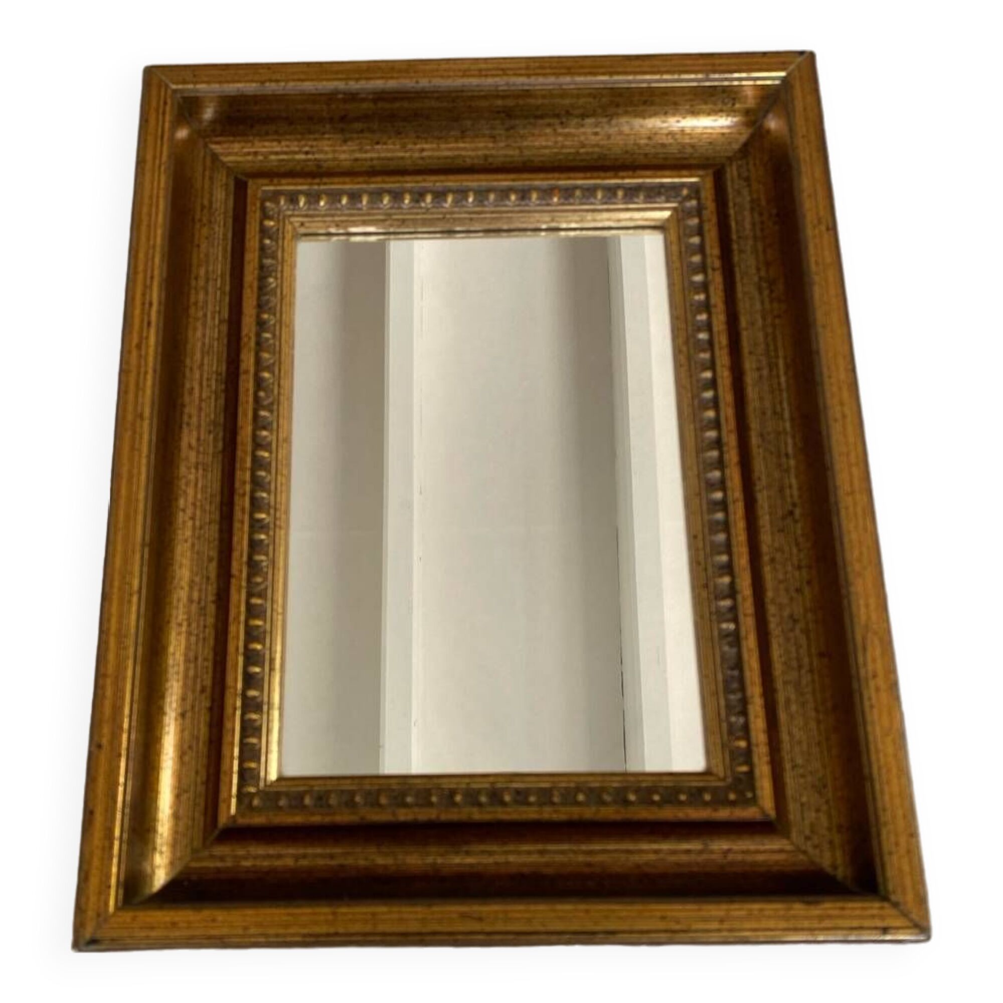 Bronze-colored framed mirror