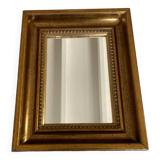 Bronze-colored framed mirror