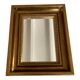 Bronze-colored framed mirror