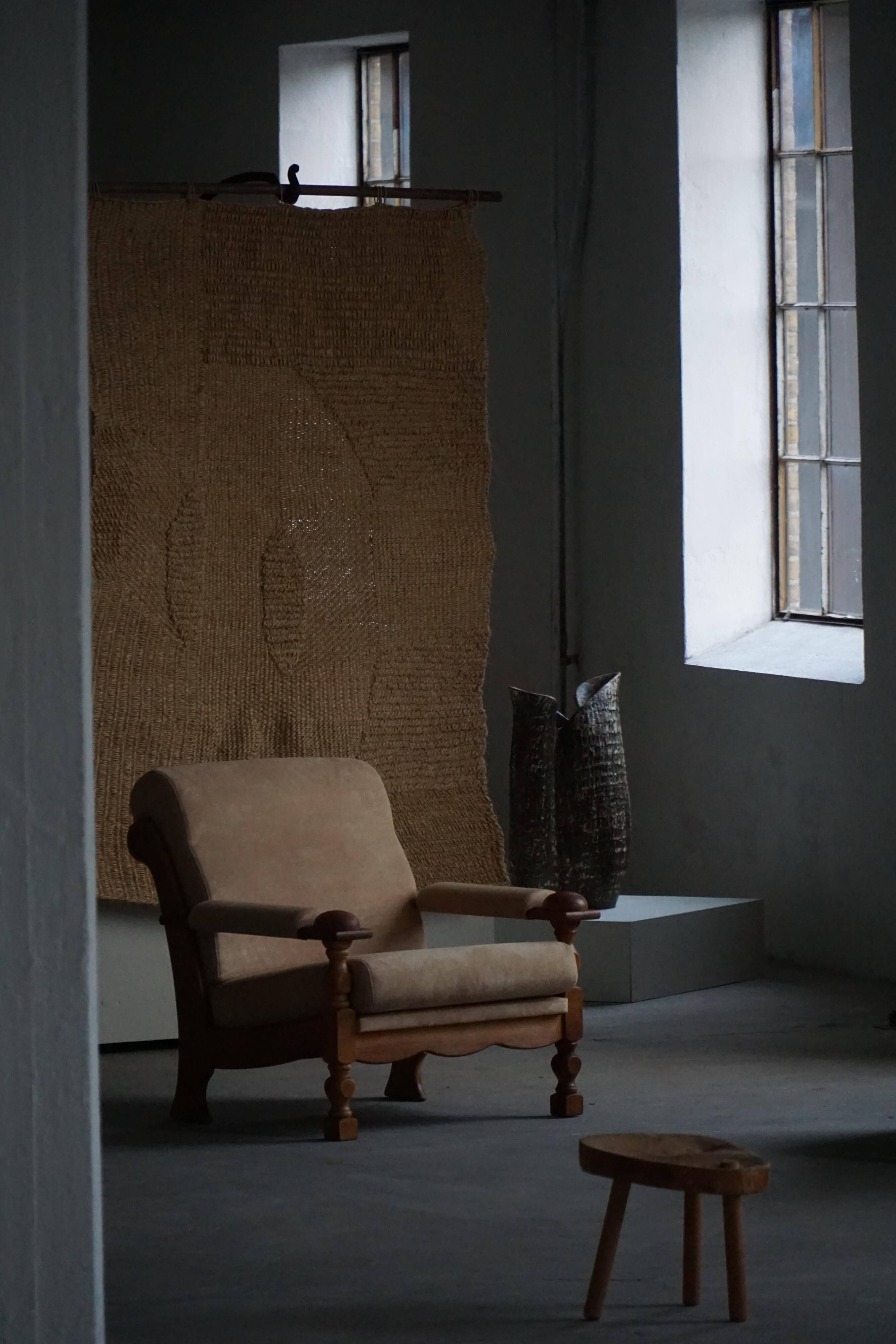 Mid-20th century, pair of armchairs by Henning Kjærnulf, oak and alcantara, 1960s.