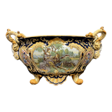 Earthenware planter with polychrome enamelled decoration on a blue background