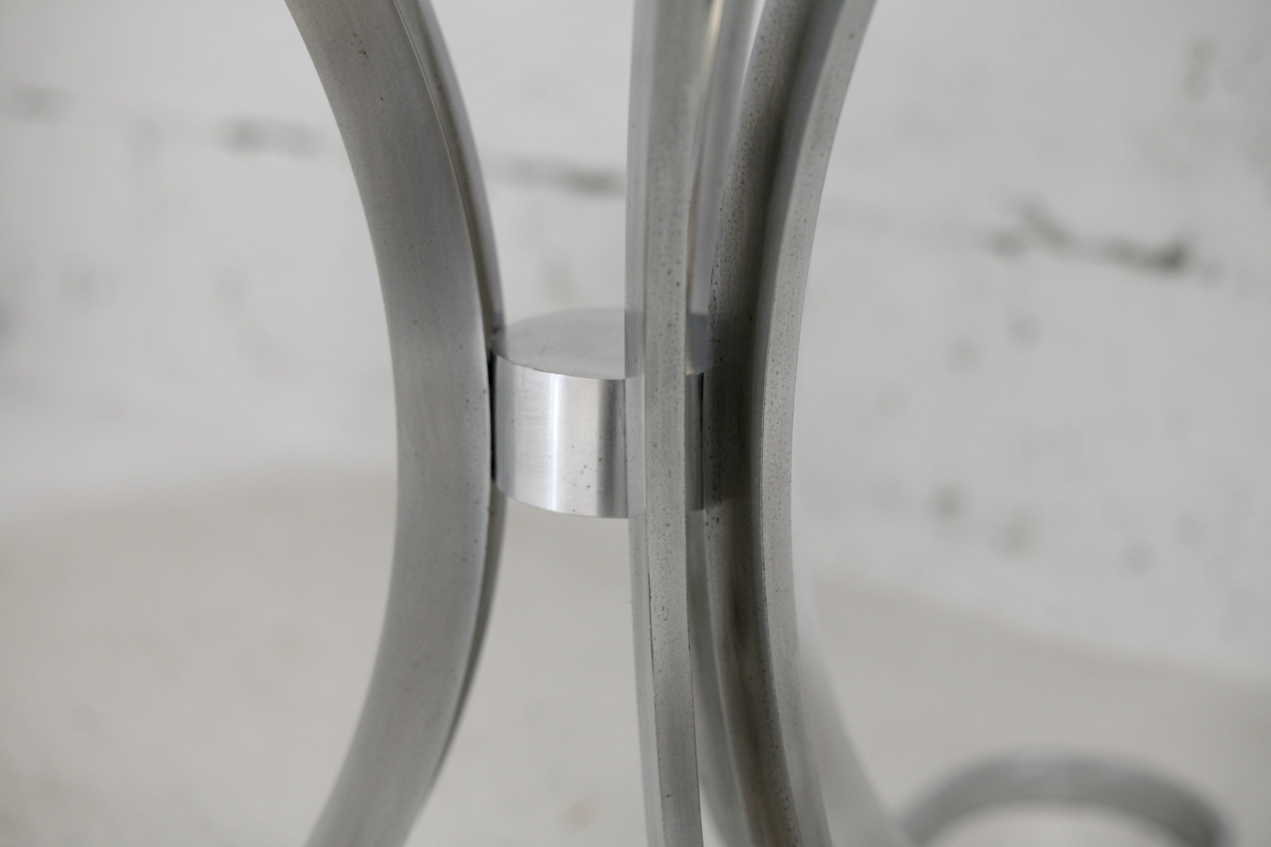 Living room table "Space Age" polished steel, circular slab smoked glass. France, circa 1970.