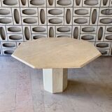 Light-colored octagonal travertine dining table