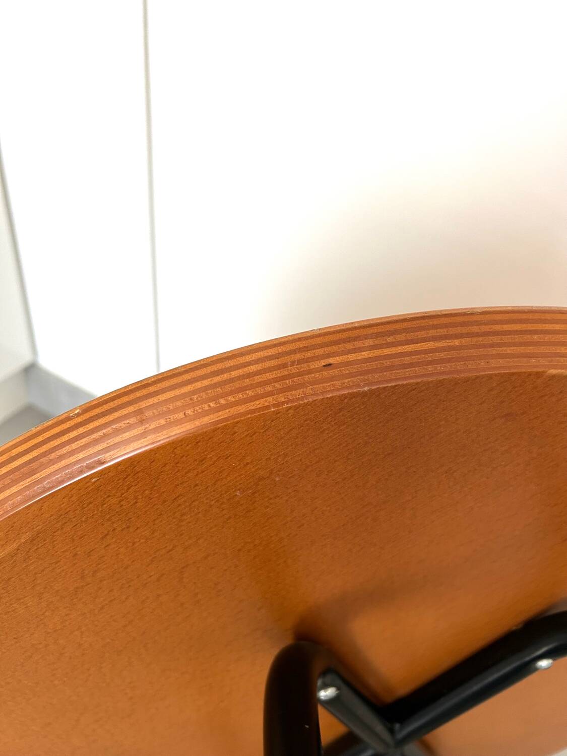 1970s coffee table in honey beech with black steel legs.