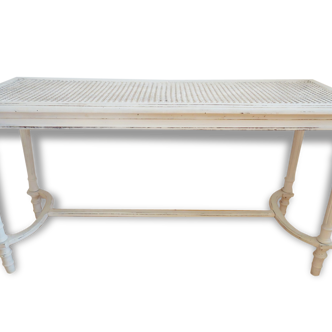 Banc de piano blanc canné