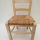 Children's chair of greige color in wood and straw