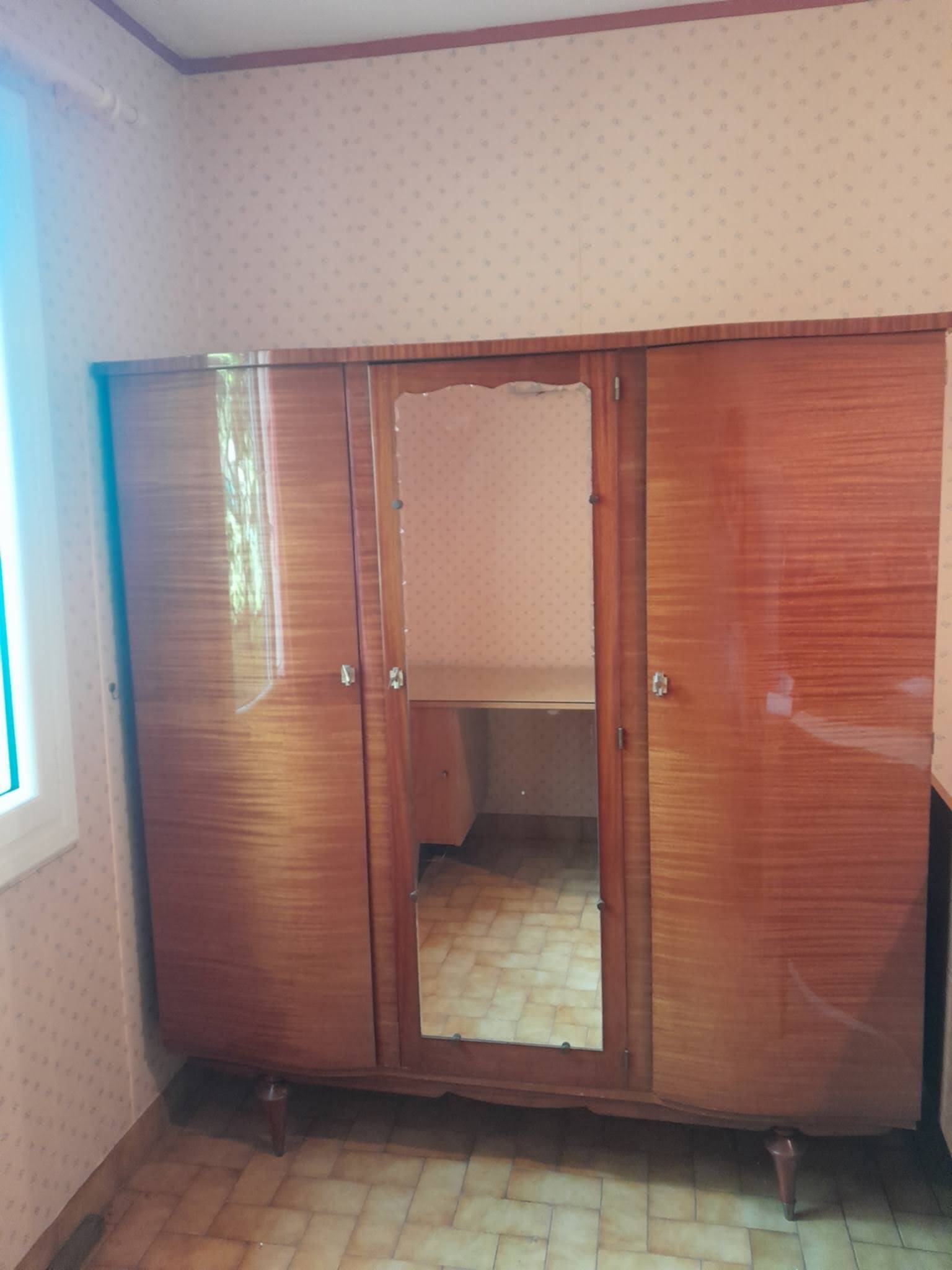 Large vintage wardrobe from the 50s/60s in wood with a mirror.