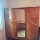 Large vintage wardrobe from the 50s/60s in wood with a mirror.