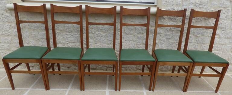 6 modern chairs with banded backs and green faux leather seats