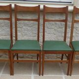 6 modern chairs with banded backs and green faux leather seats