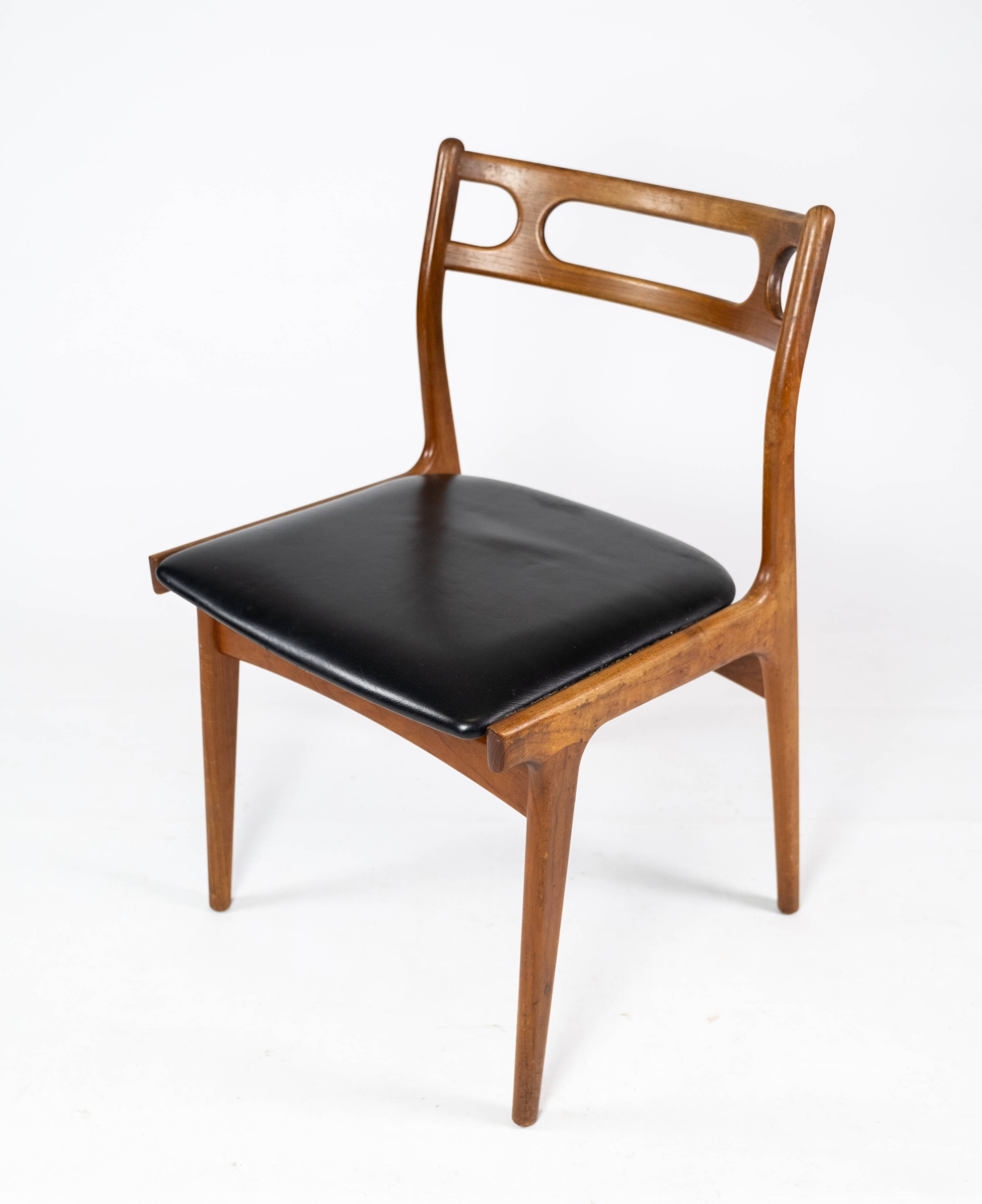 A set of four dining room chairs of teak of danish design, 1960s