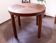 Round dining table from the 1960s with a veneered top