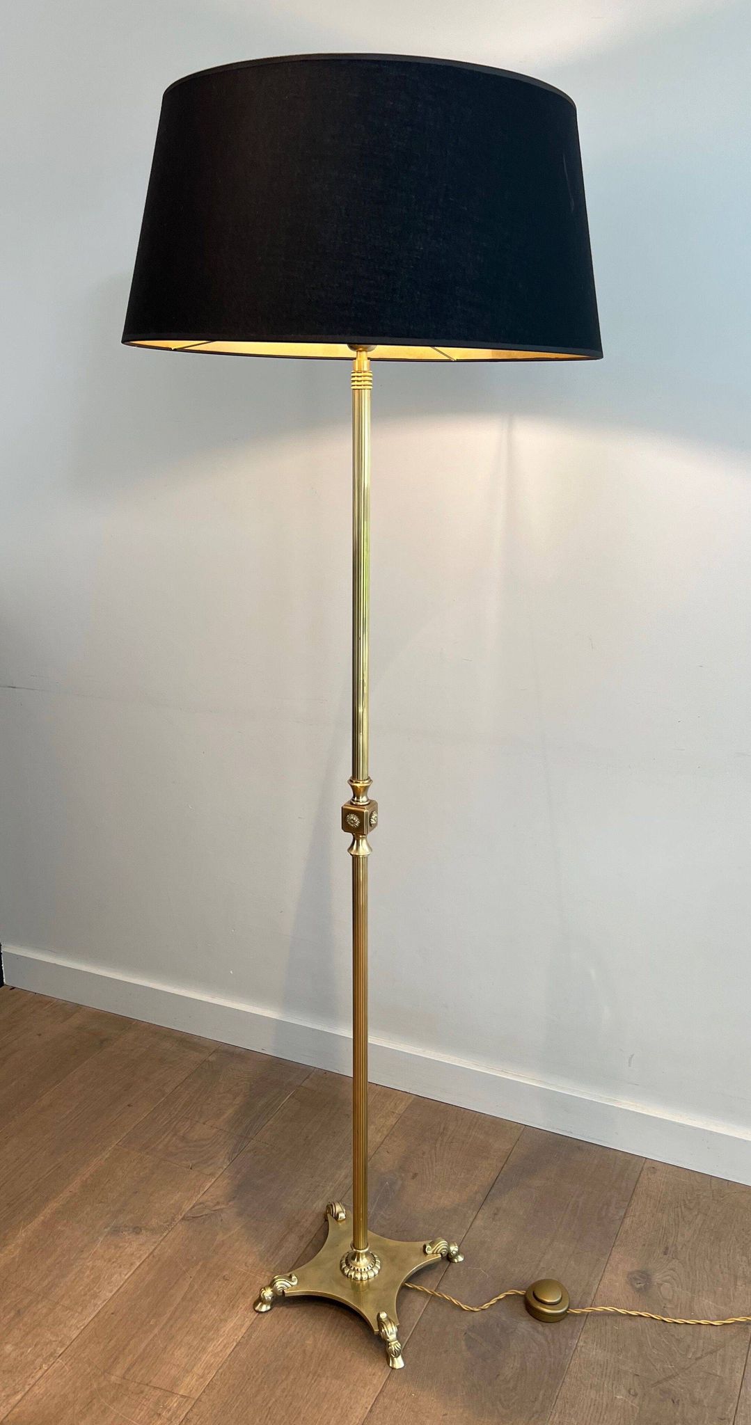 Neoclassical brass floor lamp with claw feet from Maison Jansen.