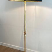 Neoclassical brass floor lamp with claw feet from Maison Jansen.