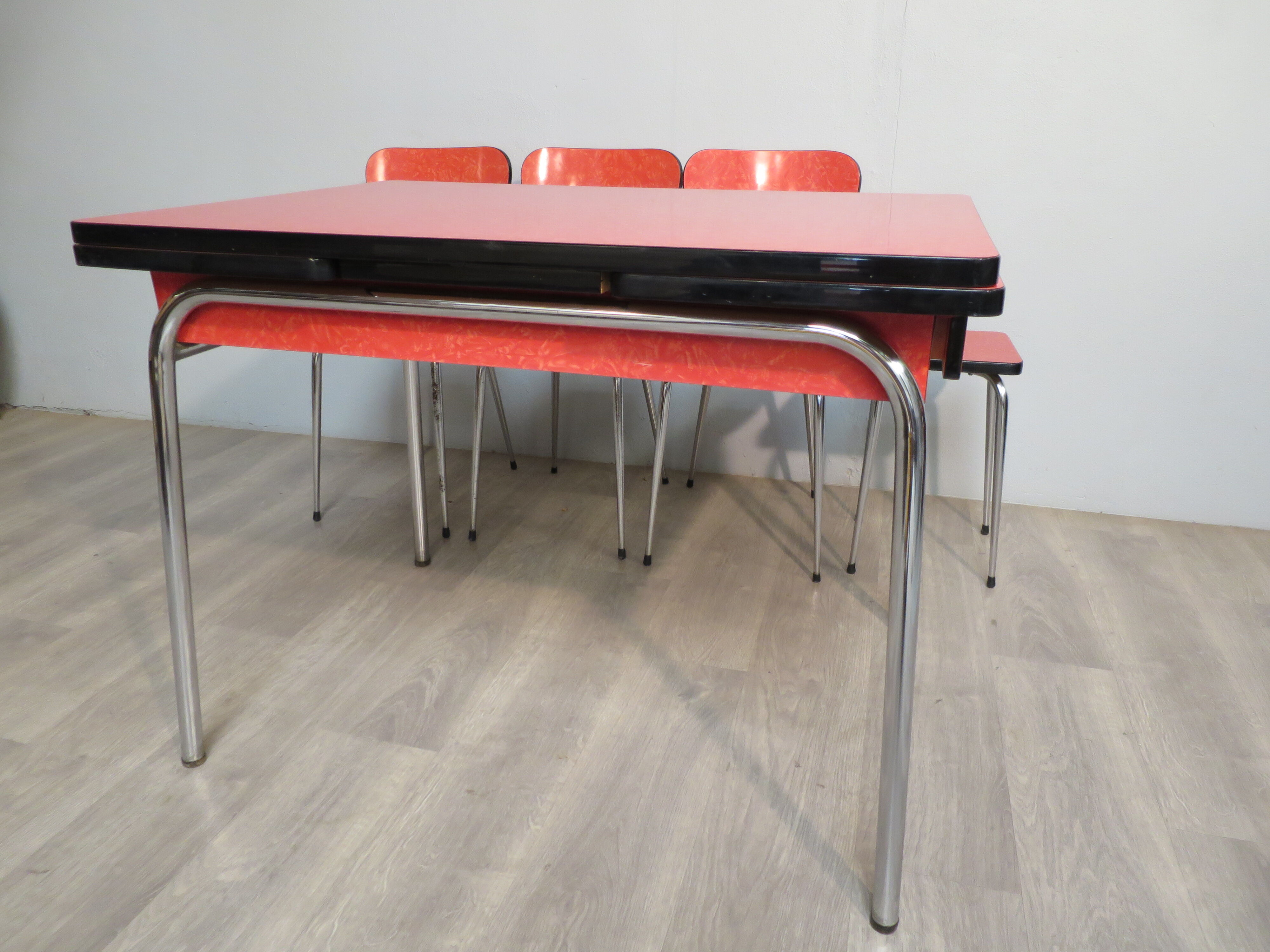 Table, 3 chairs and red formica stool