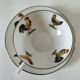 Cup and saucer in porcelain decorated with roosters and hens.