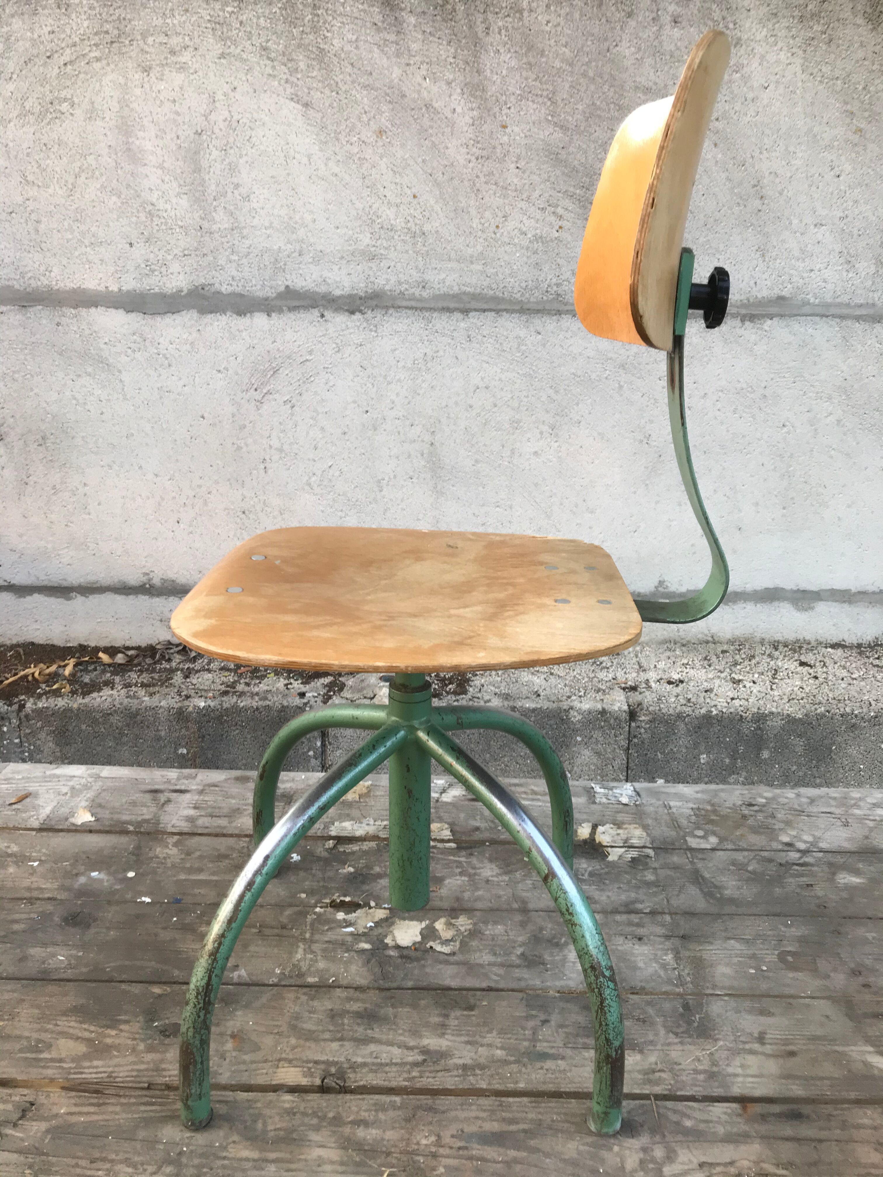 Former green metal workshop chair