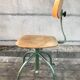 Former green metal workshop chair