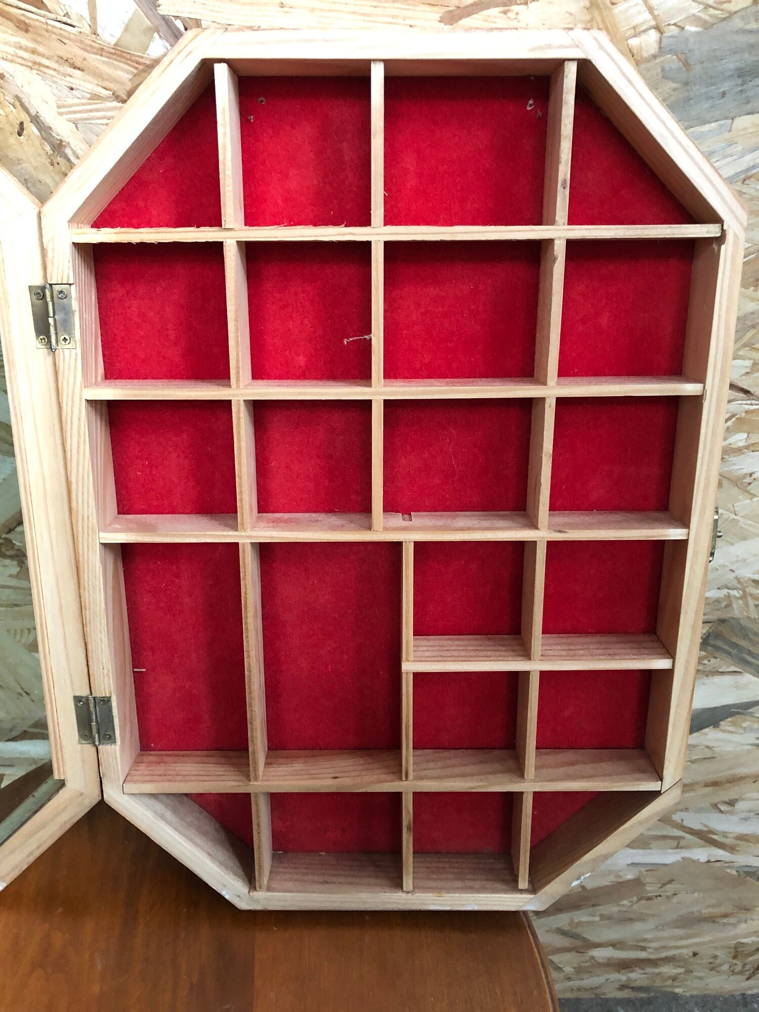 Old hanging showcase 22 wooden boxes red background