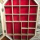 Old hanging showcase 22 wooden boxes red background