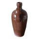 Vintage stoneware liqueur bottle with handle and spout.