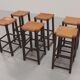 Mid-century oak bar stools with cognac leather seats