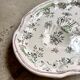 Oval Moustiers plate in cream and green earthenware, 18th century.