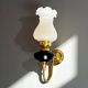 Brass wall sconce with frosted glass tulip lampshade