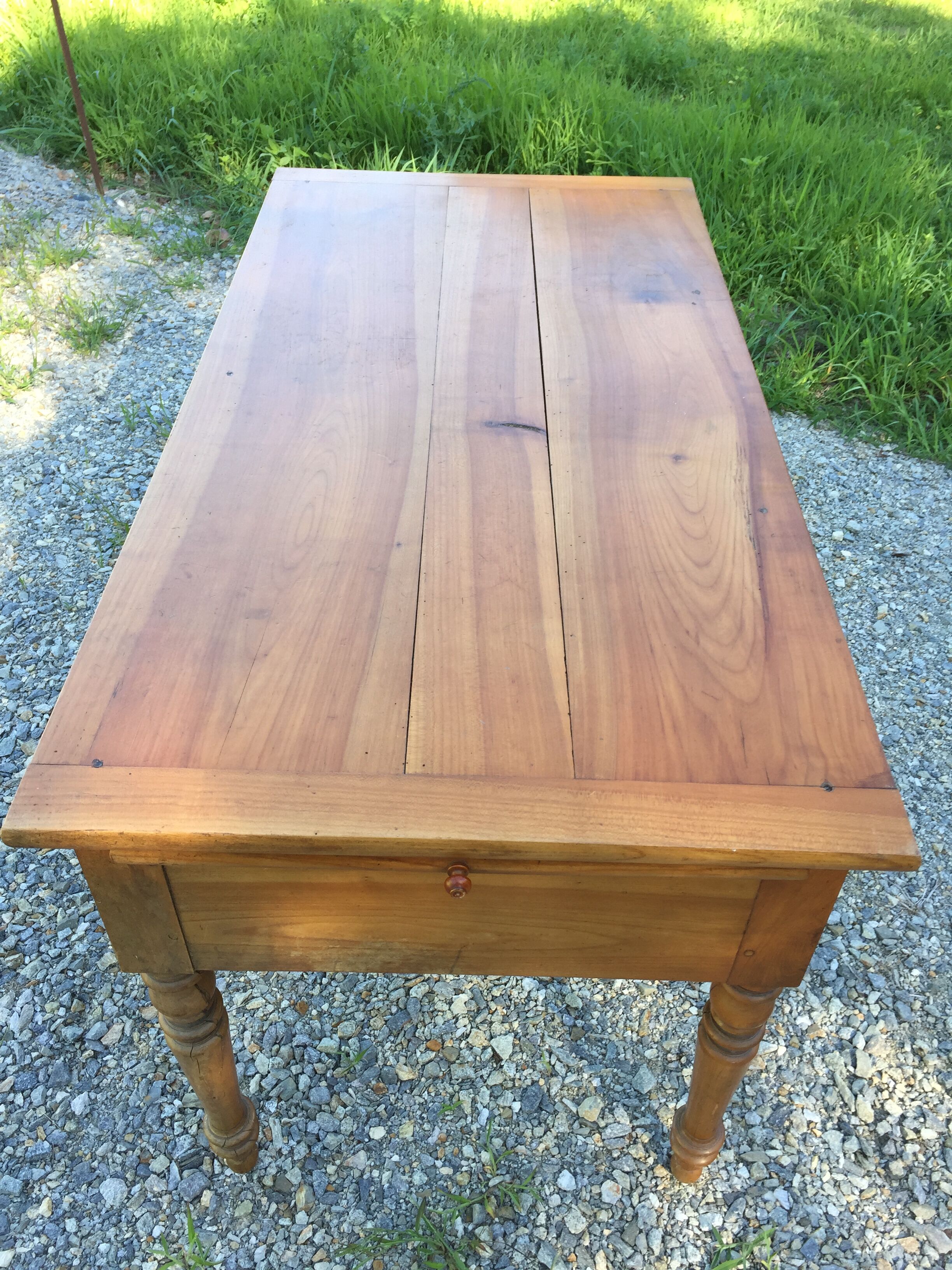 Old farmhouse table louis Philippe style in solid cherry with turned feet.