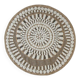 Round jute rug with white relief patterns.