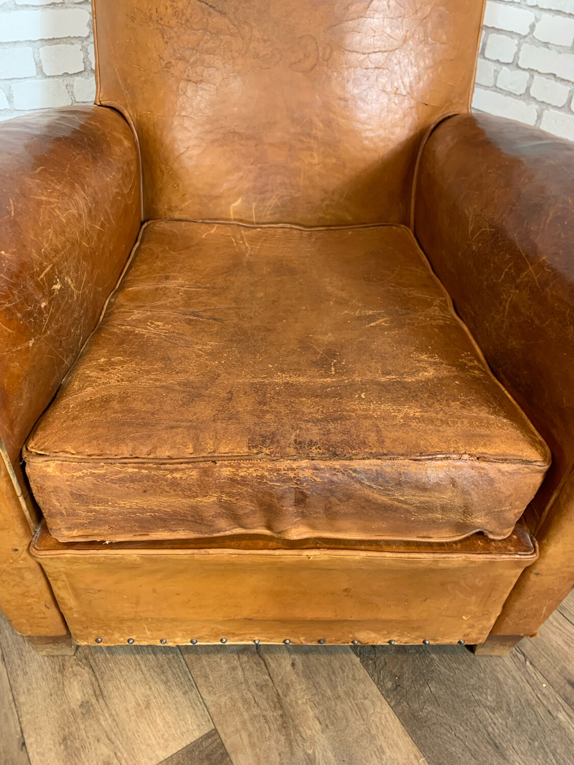 Club armchair in leather 1930