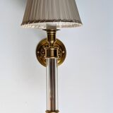 Pair of gilded bronze and plexiglass wall lights