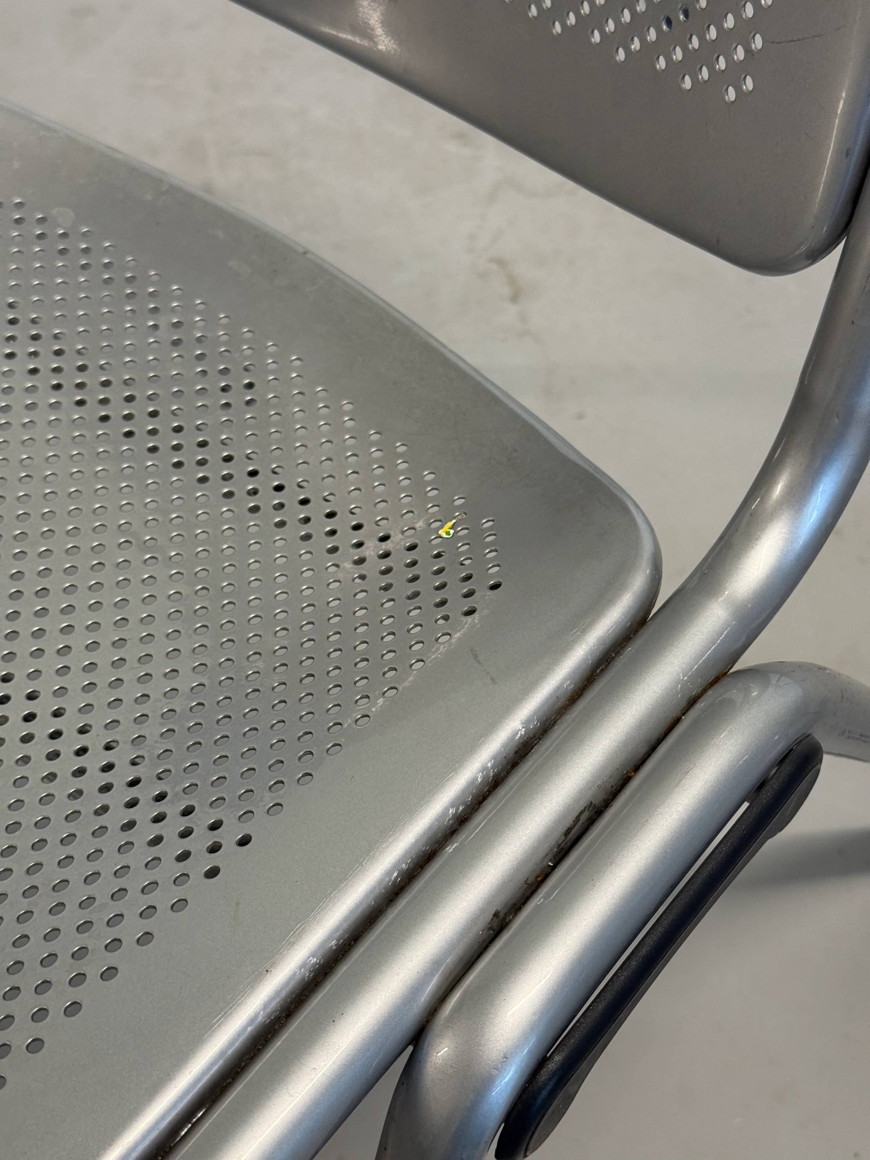 Vintage Sokoa stackable chairs, brutalist perforated metal chairs.