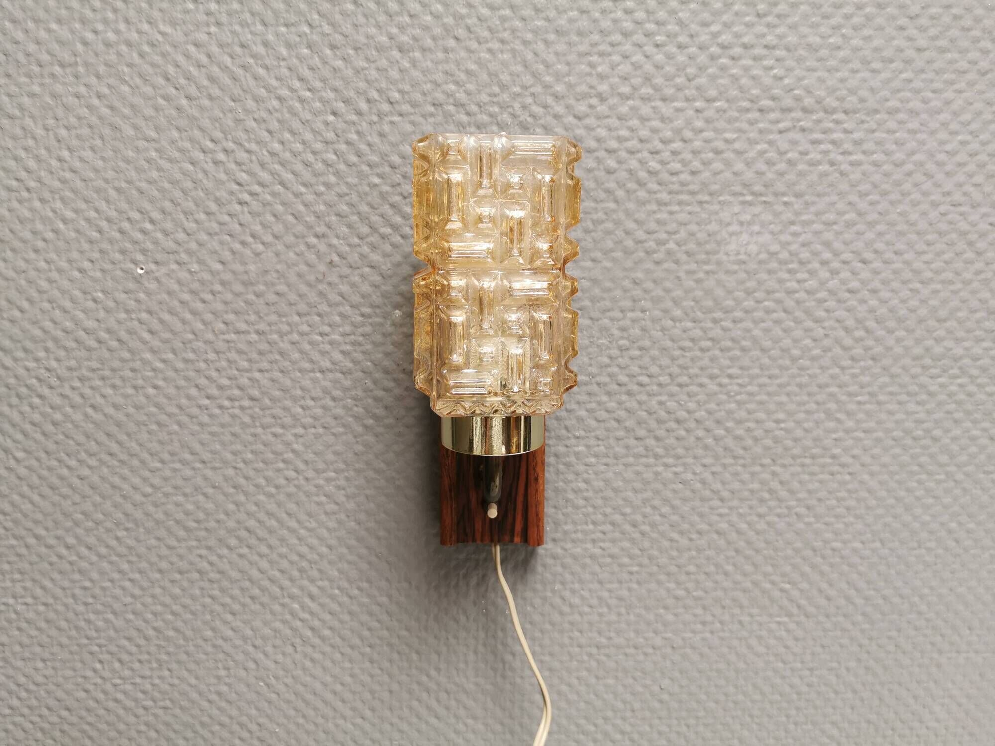Small, stylish wall lamp with rosewood suspension and hard pressed glass