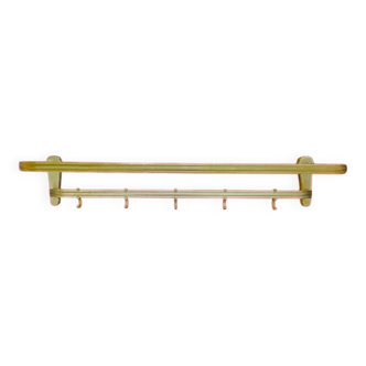 Vintage wall-mounted coat rack in anodised gold aluminium with hat holder.