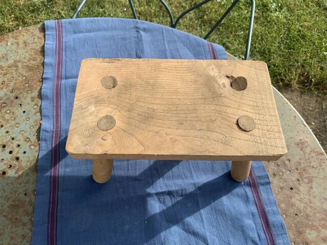 Small bench, footrest in artisanal raw wood